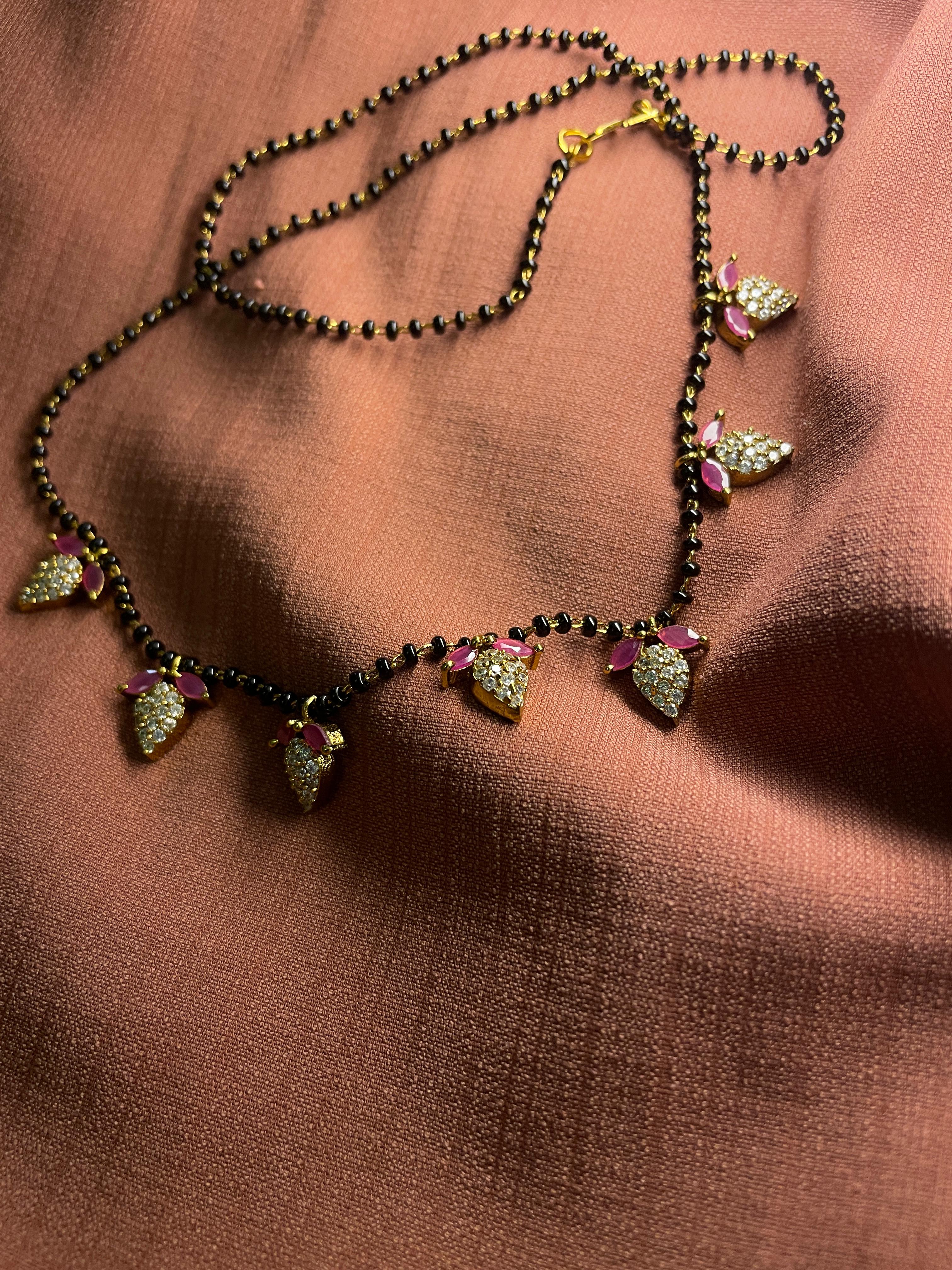 Karimani with leaf white stone ruby set